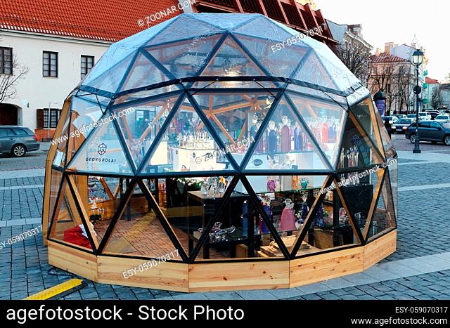 VILNIUS, LITHUANIA - DECEMBER 29, 2019: Christmas European city square of the main town hall. In Geokupolai - Geo Domes - brand bio  kiosks sell holiday sweets...