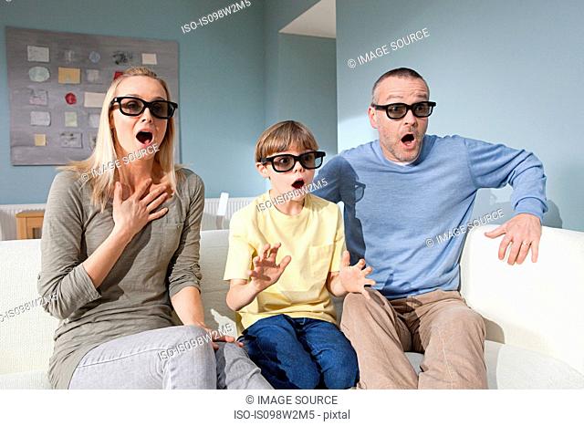 Family watching 3d movie at home