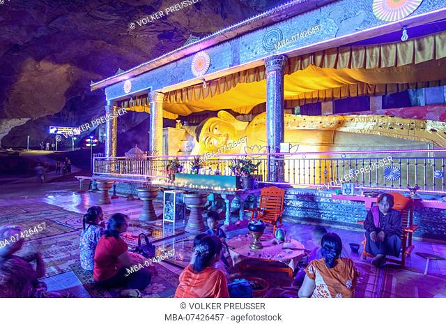 Hpa-An, Saddan (Sadan, Saddar) Cave, lime stone, reclining Buddha, praying people, devotees, Kayin (Karen) State, Myanmar (Burma)