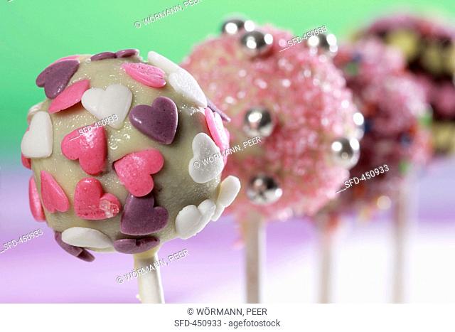 Cake pops, chilled and decorated with sugar strands