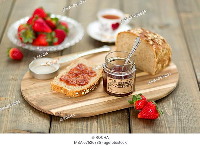 Strawberry jam, preserving jar, serving tray