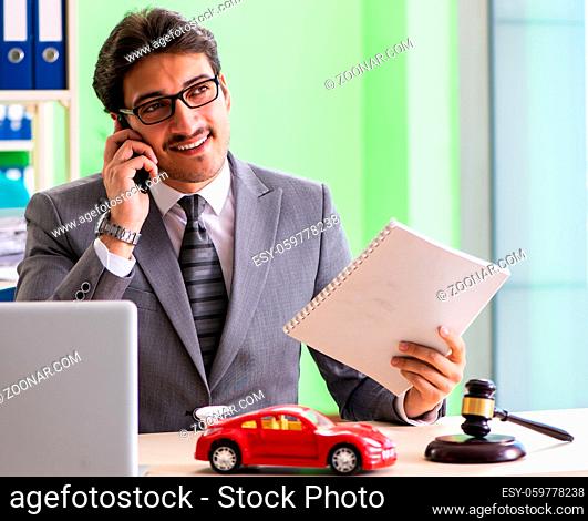 The young handsome lawyer working in the office