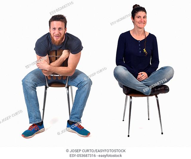 couple sitting in a vintage chair isolated on white