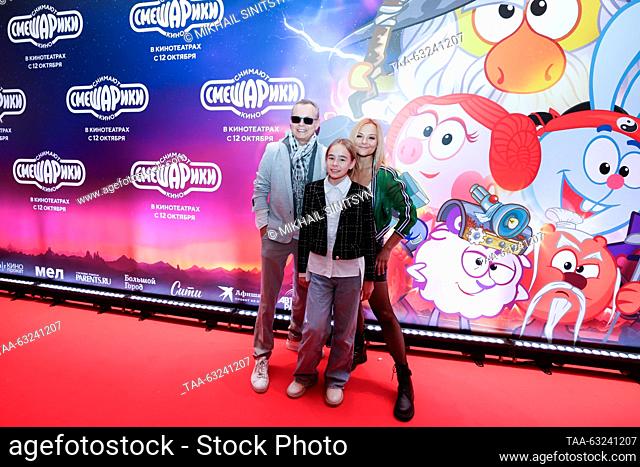 RUSSIA, MOSCOW - OCTOBER 10, 2023: Singer Vladimir Levkin and actress Marina Ichetovkina with their daughter Nika attend the premiere of the animated film...