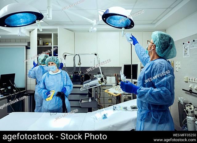 Doctors preparing trauma room of a hospital