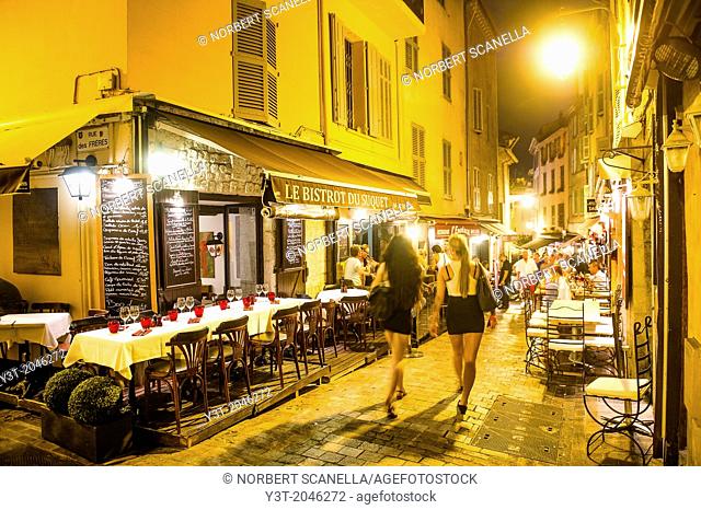 Europe, France, Alpes-Maritimes, Cannes. Tourists in old town at night