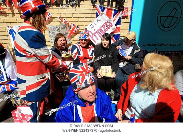 Royal fan Terry Hutt from Cambridge celebrates his 80th birthday with others waiting outside the Lindo Wing of St Mary's Hospital in London