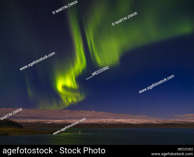 Northern Lights over Ingolfsfjoerdur and Ofeigsfjoerdur, Glacier Drangajoekull in the background. The Strandir in the Westfjords (Vestfirdir) in Iceland during...