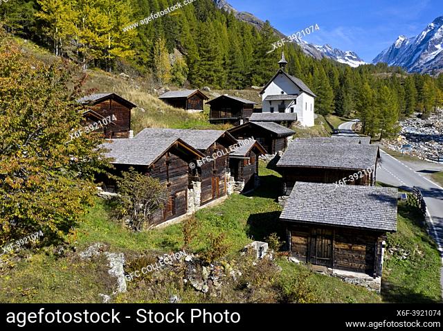 Wooden stables and storage houses in the hamlet Kühmad near the pilgrimage chapel, view at the Loetschenluecke Pass, Blatten, Lötschental, Valais, Switzerland