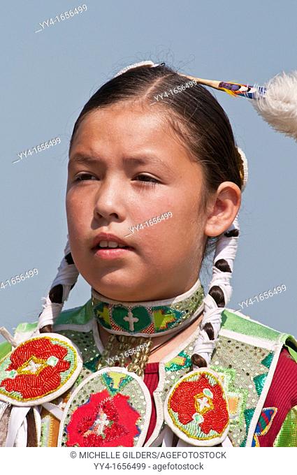 Portrait of girl's fancy or shawl dancer, Pow-wow, Blackfoot Crossing Historical Park, Alberta, Canada