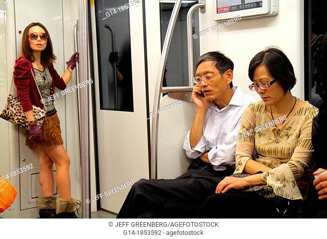 China, Shanghai, Huangpu District, East Nanjing Road Metro Station, subway, public transportation, Lavender Line 10, Mandarin symbols, hanzi, Asian, man, woman
