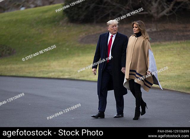 United States President Donald J. Trump walks across the South Lawn to Marine One as he and First lady Melania Trump depart the White House in Washington D