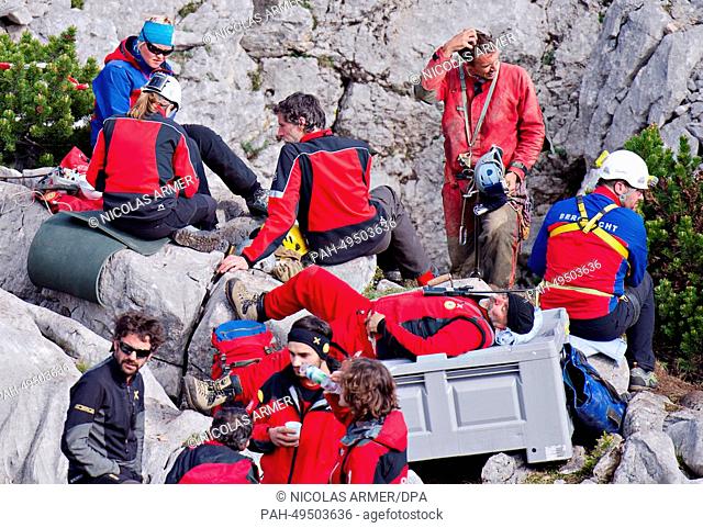 Rescuers rest near the entrance to the Riesending cave at Untersberg mountain near Marktschellenberg, Germany, 19 June 2014