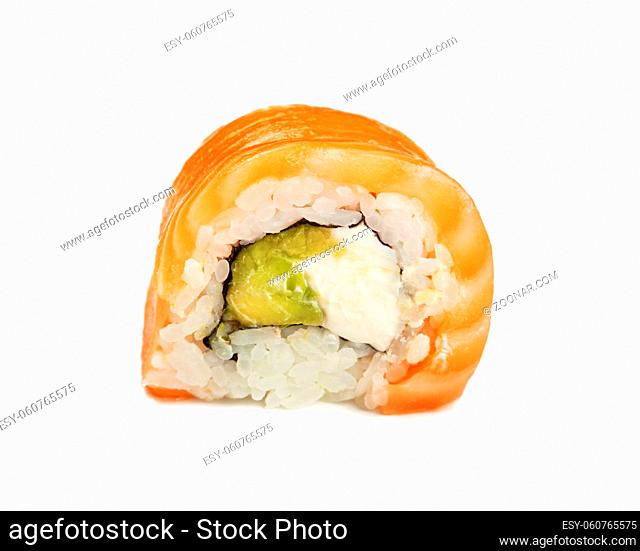 Close up one Philadelphia sushi roll with raw salmon isolated on white background, low angle side view
