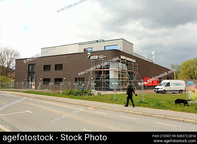 07 May 2021, Saxony-Anhalt, Wernigerode: ""Steam locomotive workshop"" is written in large letters on the façade of the new locomotive workshop of Harzer...