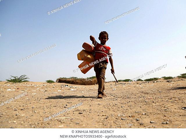 (181001) -- HODEIDAH, Oct. 1, 2018 (Xinhua) -- A boy walks on the way to collect water from a charity pump near the port of Hodeidah, Yemen, on Sept