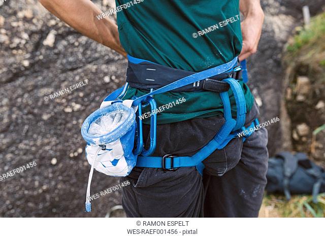 Close-up of magnesium bag and climbing harness
