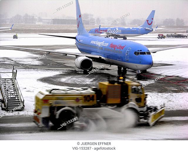 Airport Stuttgart in the winter with passenger planes oHapag-Lloyd for the travel company Tui. - STUTTGART, GERMANY, 12/01/2006