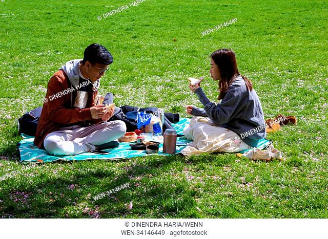 A couple having a picnic on Greenwich Park on a warm and sunny afternoon. Featuring: Atmosphere, View Where: London, United Kingdom When: 01 May 2018 Credit:...