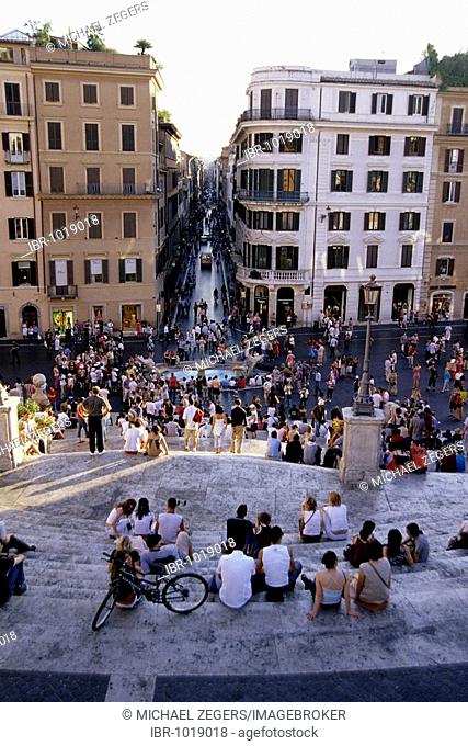 People populating Spanish Steps, Piazza di Spagna, Scalinata della Trinita dei Monti, view from above of the Via dei Condotti, Rome, Italy, Spain, Europe