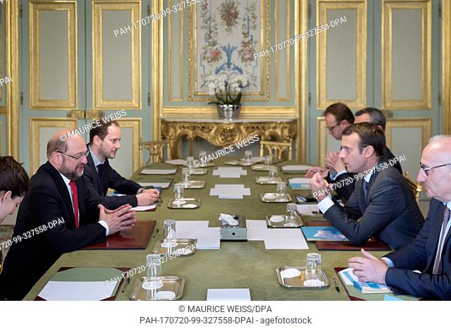 HANDOUT - Handout picture dated 20 July 2017 showing Candidate for Chancellor and SPD chairman Martin Schulz (L) meeting with French President Emmanuel Macron...