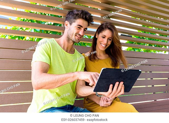 Caucasian couple use of the tablet pc together