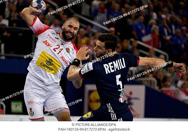 France's Nedim Remili (R) in action against Spain's Joan Canellas during the European Men's Handball Championship match between France and Spain in Zagreb