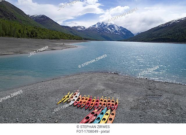 Colorful canoes at beach against sky, Anchorage, Alaska