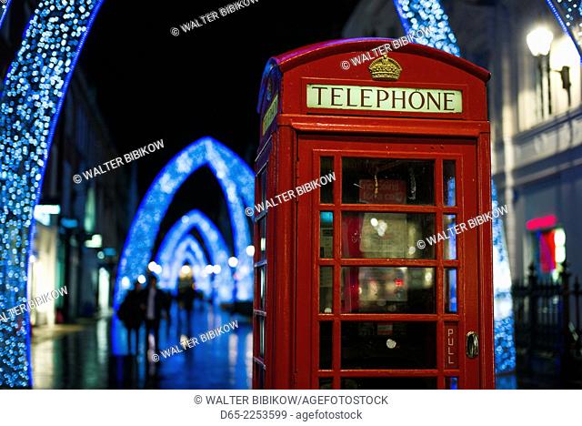 England, London, Soho, English telephone box and Christmas decorations