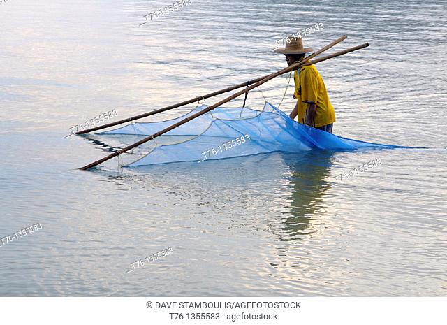 fisherman at dawn in Khao Sam Roi Yot National Park in Thailand
