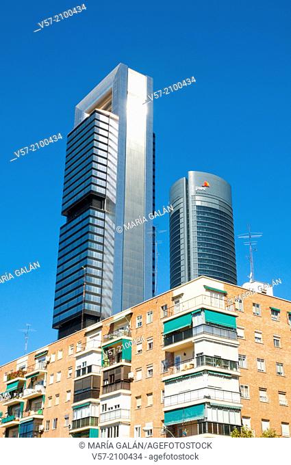Two of the Four Towers contrasting with tenements. Madrid, Spain