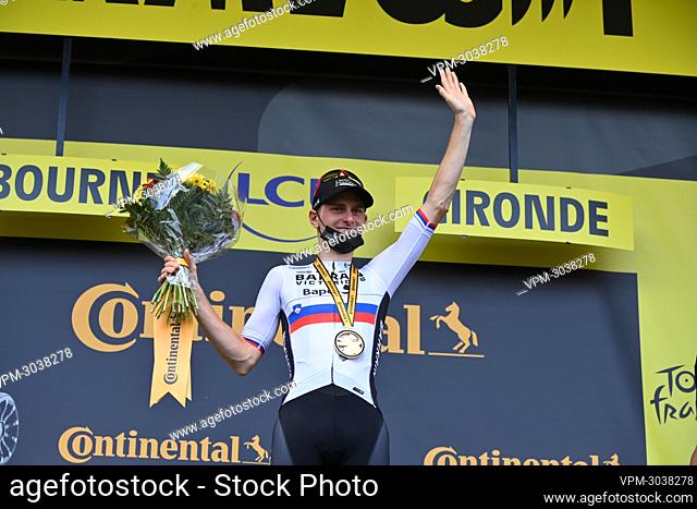 Slovenian Matej Mohoric of Bahrain Victorious celebrates on the podium after winning stage 19 of the 108th edition of the Tour de France cycling race