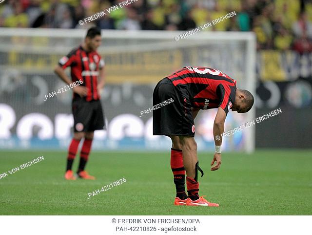 Frankfurt's Bamba Anderson (R) and Carlos Zambrano are disappointed after the German Bundesliga match between Eintracht Frankfurt and Borussia Dortmund at...