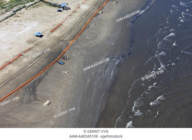 Oil booms on the beach at Grand Isle. Jefferson Parish, Louisiana. July 2010