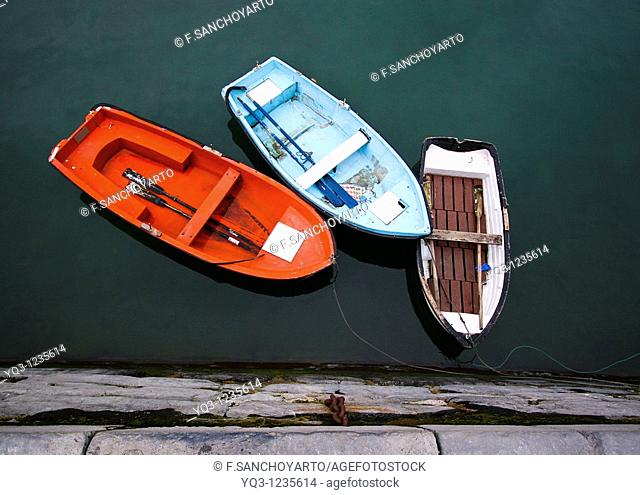 Auxiliar boatsalongside dock. Port of Castro Urdiales , Cantabria, Spain