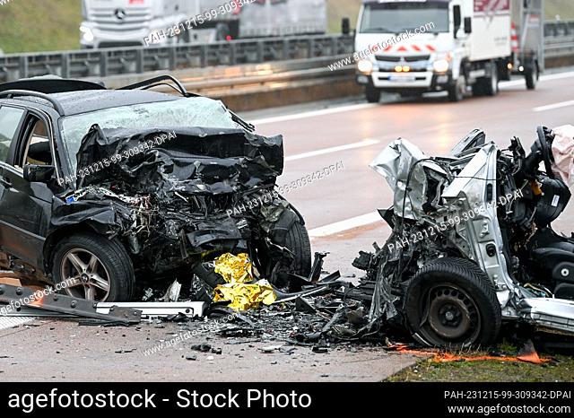15 December 2023, Saxony-Anhalt, Querfurt: The cars involved in the serious accident with a wrong-way driver on the A38. Three people were killed in the...