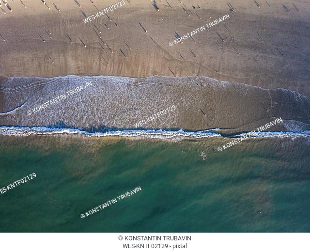 Indonesia, Bali, Aerial view of Jimbaran beach from above, people