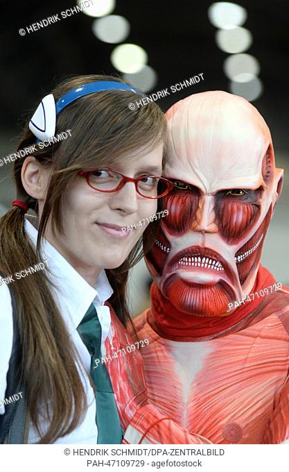Cosplayers Yvonne and Sebastian pose for the camera at the Leipzig Book Fair in Leipzig, Germany, 14 March 2014. The book fair runs until 16 March