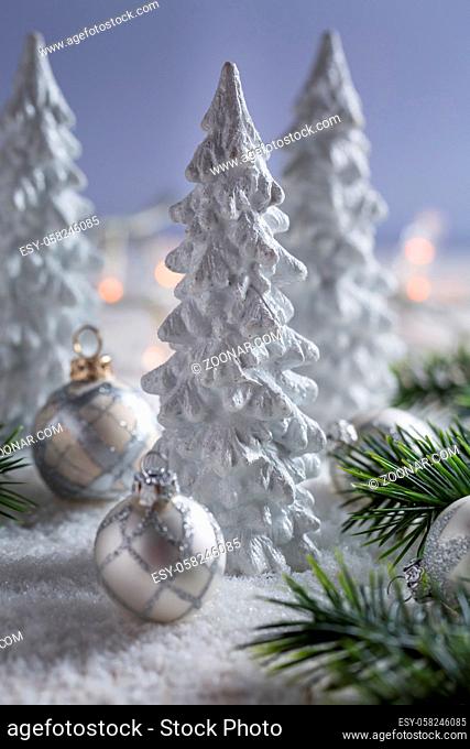 White trees with small Christmas balls as snowy landscape. Christmas decoration
