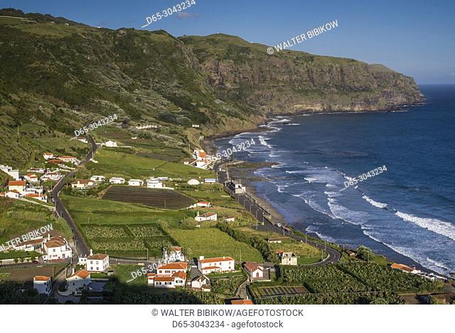 Portugal, Azores, Santa Maria Island, Praia, elevated view of town and Praia Formosa beach, late afternoon