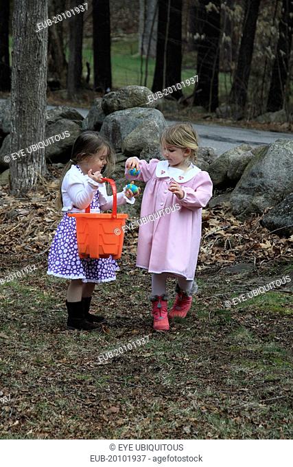Young girls Kylan Stone and Sarah Bleau hunting for Easter eggs in Keene New Hampshire