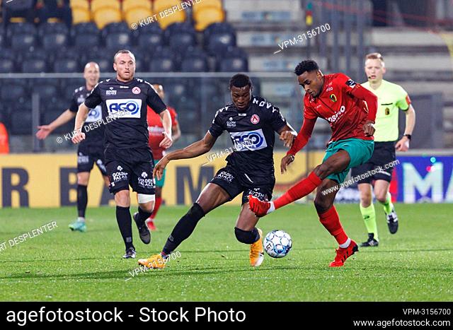 Kortrijk's Muhammed Badamosi and Oostende's Steven Fortes fight for the ball during a soccer match between KV Oostende and KV Kortrijk