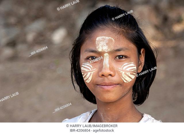 Local girl with Thanaka paste on her face, portrait, Inwa, Mandalay region, Myanmar