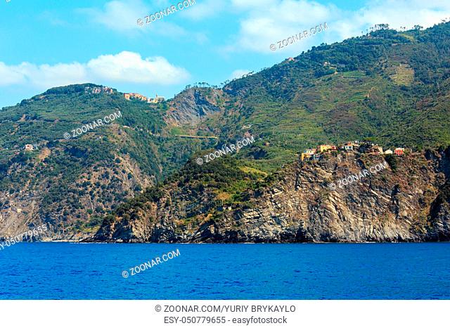 Beautiful summer Corniglia view from excursion ship. One of five famous villages of Cinque Terre National Park in Liguria, Italy