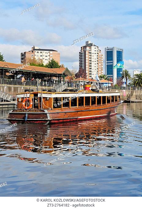 Argentina, Buenos Aires Province, Tigre, Vintage mahogany motorboats by the Fluvial Station on the Tigre River Canal