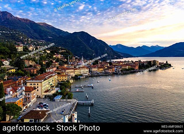 Italy, Province of Como, Menaggio, Helicopter view of town on shore of Lake Como at dawn