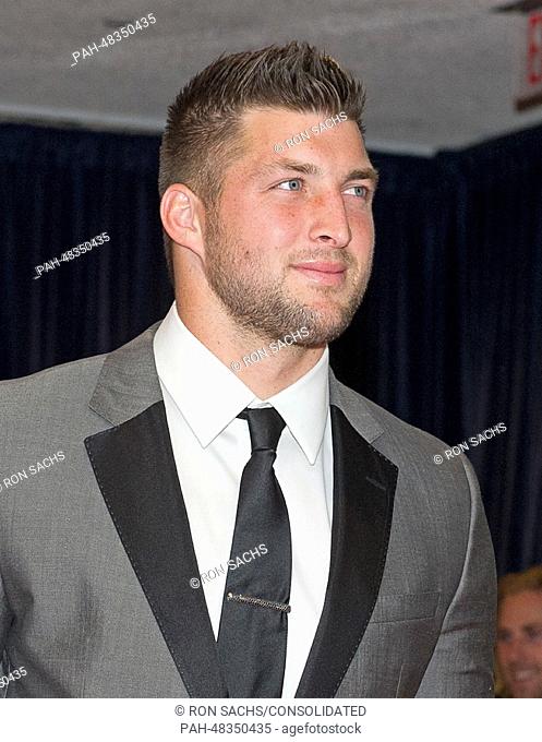 Tim Tebow arrives for the 2014 White House Correspondents Association Annual Dinner at the Washington Hilton Hotel in Washington, D.C