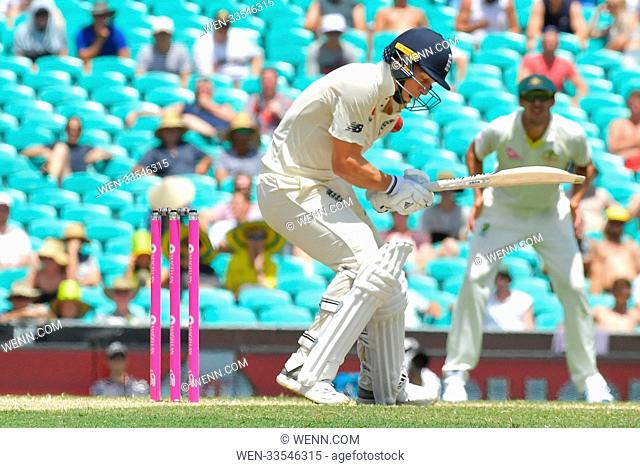 Tom Curran is hit by a bouncer from Pat Cummins during the Fifth Test match in the 2017/18 Ashes Series between Australia and England at Sydney Cricket Ground...