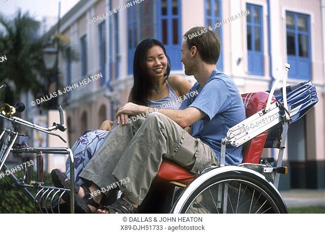 Singapore, Clarke Quay, Couple in Rickshaw