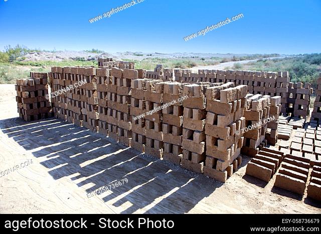 handmade clay bricks for Kyzyl-kala fortress repair in Kyzylkum Desert, Uzbekistan